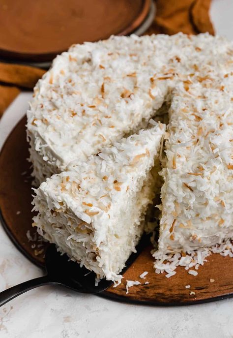 This super moist coconut cake recipe keeps things simple with boxed white cake mix. Topped with a silky smooth coconut frosting, it's every coconut lover's dream. Moist Coconut Cake Recipe, Easy Coconut Cake Recipe, Easy Coconut Cake, Moist Coconut Cake, Best Coconut Cake Recipe, Cake Coconut, Coconut Cake Recipe, Coconut Cupcakes, Coconut Frosting