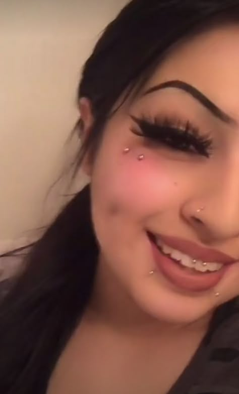 Her tiktokdestinyr559 *not mine* Face Dermals Piercings, Mouth Piercing Ideas, Cute Mouth Piercings, Under Eye Dermal Piercing, Dermal Under Eye Piercing, Anti Eyebrow Piercing Butterfly Kiss, Cute Dermal Piercings, Anti Eyebrow Piercing Dermal, Face Dermal Piercing Cheek