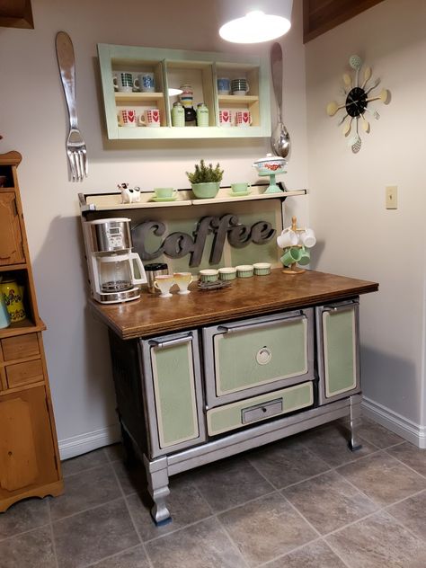 Upcycled this beautiful vintage woodstove into a coffee bar. My dad made the custom fitted wooden top and I had the old wooden window hanging above made into a shelf to showcase my ol mugs. That and the clock on the wall were painted to match the stove. Cree~ative Concepts by Colleen  #vintage #antique #woodstove #coffeebar #upcycle   #oldwindow #ascp #chalkpaint #fireking #jadeite #termocrisa Vintage Wood Stove, Antique Kitchen Stoves, Stove Decor, Vintage Stove, Vintage Oven, Hoosier Cabinet, Old Stove, Vintage Stoves, Antique Stove