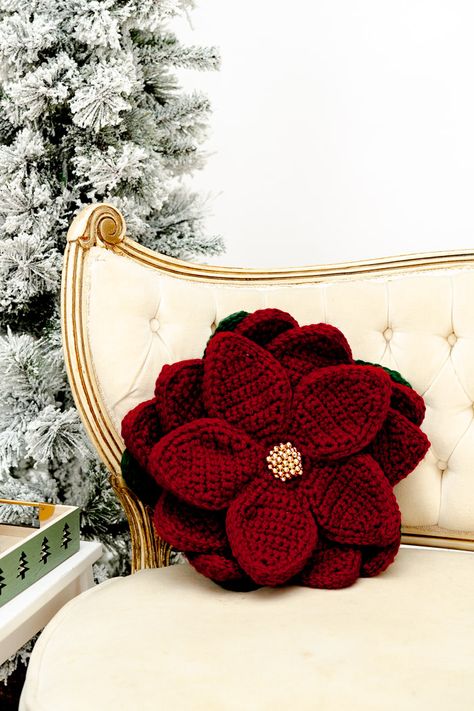 Elevate your holiday decor with the exquisite Poinsettia Pizzazz Pillow, a striking 3-D crochet creation that brings a burst of festive color and whimsy to any space. This show-stopping pillow features layers of crocheted petals, intricately arranged to replicate the iconic Christmas flower in all its glory. Crochet Poinsettia Free Pattern, Advanced Crafts, Crochet Christmas Lights, Advanced Crochet Stitches, Crochet Apparel, Iconic Christmas, Bottle Cozies, Advanced Crochet, Crochet Xmas