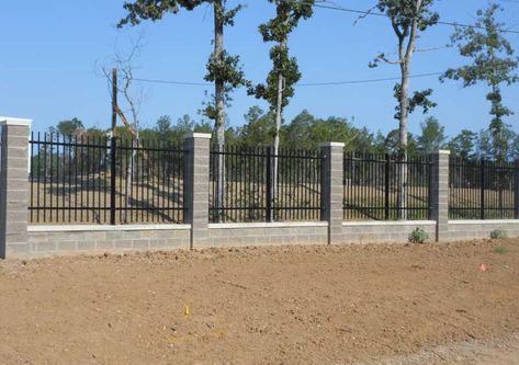 Wrought Iron Fence with Stone Columns. Use cement blocks for material, then cover with stone finish Cement Fence, Block And Iron Fence, Brick Metal Fence, Block Wall With Iron Fence, Brick Pillar Fence, Split Rail Fence With Stone Pillars, Stone Fence Columns, Metal Fence With Brick Columns, Brick Columns