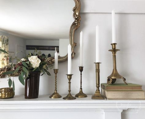 Vintage brass candlesticks on a faux mantel Candlesticks On Fireplace Mantle, Brass Candlesticks On Mantle, Candlesticks On Mantle, Brass Home Decor, Brass Candlesticks Mantle, Brass Candlesticks Decor, Candle Stick Centerpiece Brass, Vintage Brass Candlesticks Christmas, Wedding Brass Candlesticks