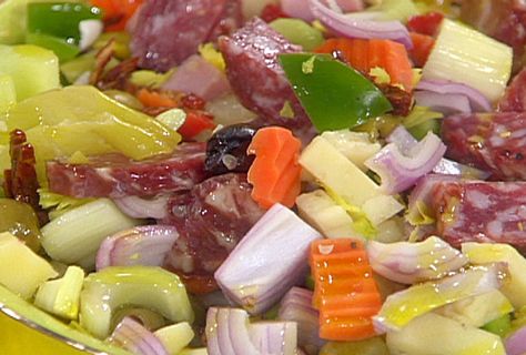 Muffaletta Salad from FoodNetwork.com (KM: this is one of my husband's favorite salads, and it's the perfect way to use all your leftover veggies and deli meats. I never use all the oil that's recommended in the recipe because the tang from the pickled veggies make their own dressing.) Muffaletta Salad Recipe, Muffaletta Salad, Muffuletta Salad, 1905 Salad Recipe, Antipasto Recipes, Pickled Cauliflower, Rachael Ray Recipes, Emeril Lagasse, Macaroni Salad