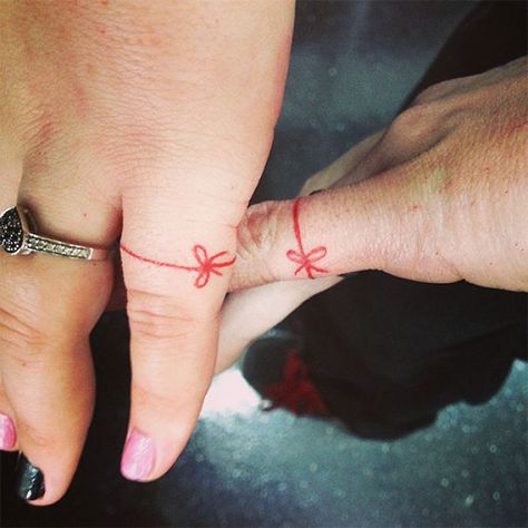 Matching Wedding Tattoos | Bored Panda Red String Tattoo, Couple Tattoos Love, Best Couple Tattoos, See Tattoo, Red String Of Fate, Wedding Ring Tattoo, Tattoo Wedding Rings, Couples Tattoo Designs, Bow Tattoo