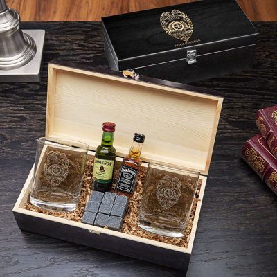 Show the brave police officer in your life just how much you value them with these impressive whiskey gifts for police officers! Included are two custom whiskey glasses, a set of nine whiskey stones that come with a velvet travel pouch, and a handsome black wooden gift box. The cop you know will enjoy coming home and enjoying a nice glass of scotch on the rocks with their new custom glass and a couple of the handy whiskey stones! In fact, they might share a drink with their partner once their sh Custom Whiskey Glasses, Whiskey Gift Set, Whiskey Glasses Set, Wood Gift Box, Whiskey Stones, Macrame Christmas, Wine Gift Baskets, Police Gifts, Whiskey Gifts