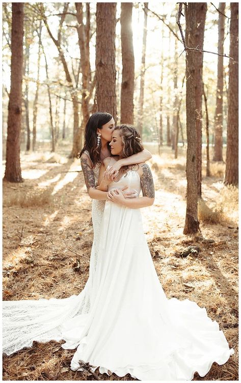 Romantic lesbian wedding photo of two brides their outdoors wedding in the woods decorated with white arch and flowers | Earthy Fall Wedding Inspiration with Organic Details - Love Inc. Mag - LAURA POWERS PHOTO Two Brides Wedding Photography, Lesbian Wedding Party Photography Poses, Cottage Core Lesbian Wedding, Lesbian Wedding Photoshoot Photo Ideas, Wedding Festival Theme, Wedding Photos Lesbian, Lesbian Fall Wedding, Lesbian Wedding Photography Poses, Wlw Wedding Aesthetic