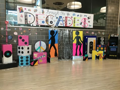 70s Themed School Dance, Homecoming Decades Theme, Decade Dance Decorations, Disco Hallway Decorations, 70s Homecoming Theme, Decades Theme Party Decoration, 70s Party Backdrop, 70s Stage Design, Decades Dance Decorations