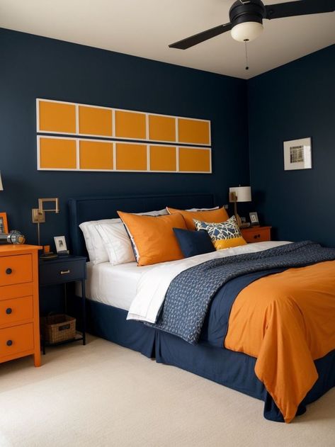 Create a bold and stylish bedroom for boys by painting one wall in a deep navy color. Complement the accent wall with a modern industrial-inspired bed frame and add pops of orange or yellow through throw pillows and decor for a vibrant touch. Orange Boys Bedroom, Boys Bedroom Orange, Orange Boys Rooms, Navy Accent Wall, Bedroom For Boys, Orange Bedroom Decor, Navy Accent Walls, Orange Paint Colors, Navy And Orange