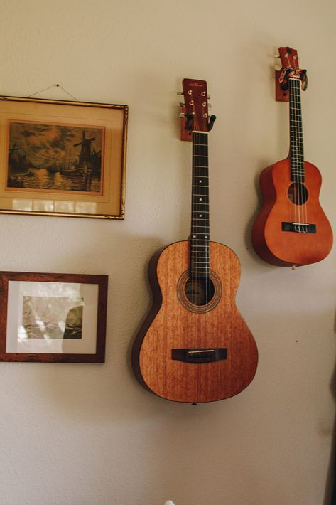 Guitar Wall Aesthetic, Ukulele Decoration, Guitar On Wall, Ukulele On Wall, Guitar Ukulele Wall, Guitar In Room Aesthetic, Ukulele Aesthetic, Ukulele Hanging On Wall, Guitar And Ukulele On Wall