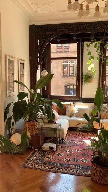 Apartment Therapy on Instagram: "Plants + sun 💚 via @tinchenwaldkindlissi" Vintage Living Room Design, Vintage Rattan Furniture, Spanish Apartment, Earthy Living Room, Chicago Apartment, Boho Interiors, Apartment Aesthetic, Vintage Living Room, Salou