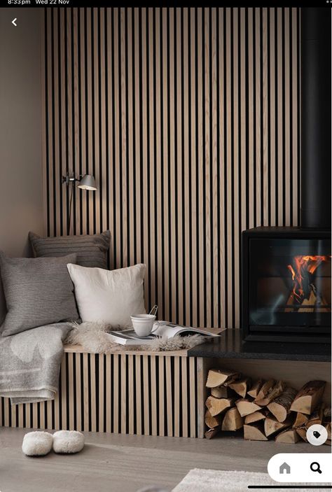 Fireplace With Sitting Bench, Slat Wall With Bench, Wooden Panneling Rooms Living Room, Wood Slat Wall Living Room, Wood Slat Fireplace, Inviting Interior Design, Built In Bench Seating, Rustic European, Oak Timber Flooring