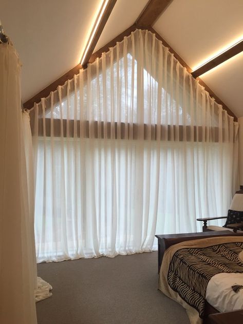 A great idea for dressing a large apex window.  Soft voile curtains with a cartridge pleat heading. By Clare Laughland Interiors Triangle Window Coverings, Apex Curtains, Large Window Curtains, Apex Window, Triangle Window, Barn Window, Attic Windows, Curtains Bed, Gable Window