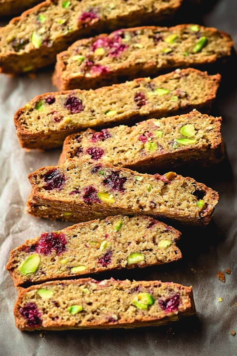 If you’re looking for a crunchy, nutty treat that pairs perfectly with your favorite coffee or tea, these Cranberry Pistachio Biscotti are just what you need! These delightful cookies are packed with tart cranberries and crunchy pistachios, creating a sweet and nutty flavor combination that’s simply irresistible. What makes these biscotti so special is their delightful texture—crunchy on the outside and perfect for dipping. These Cranberry Pistachio Biscotti are ideal for holiday gatherings, ... Biscotti With Pistachios, Cranberry And Pistachio Biscotti, Pistachio And Cranberry Biscotti, Pistachio Cranberry Biscotti, Pistachio Biscotti Recipe, Cranberry Biscotti Recipe, Best Biscotti Recipe, Cranberry Biscotti, Cranberry Pistachio Biscotti