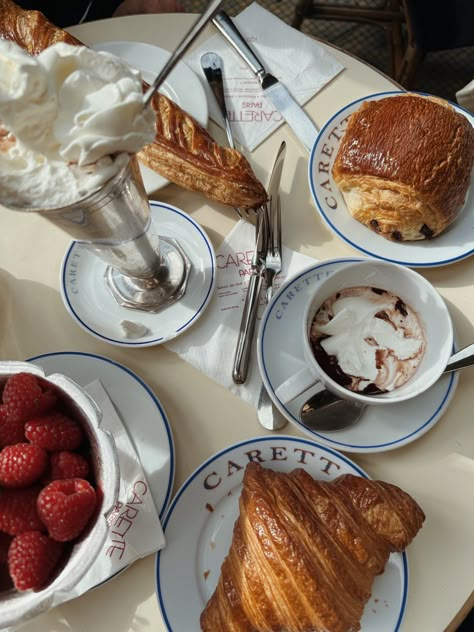 parisian breakfast, carett, raspberries, croissant, chocolate croissant, hot chocolate, paris, parisian hot chocolate, whipped cream, table set up Hot Chocolate And Croissant Paris, Parisian Breakfast Aesthetic, Coffee And Dessert Aesthetic, Hot Chocolate And Croissant, Parisian Croissant, Parisian Hot Chocolate, Hot Chocolate Whipped Cream, Croissants Paris, France Dessert