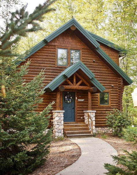 split-log-home-facade-stone-pillars-748b1673 Log Home Exterior Colors, Cabin Exterior Colors, House Siding Options, Exterior Siding Options, Log Homes Exterior, Rustic Home Exterior, Log Cabin Exterior, Log Home Interiors, Siding Options