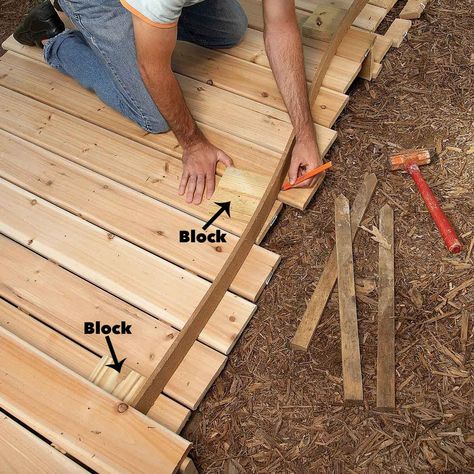 How to Build a Wooden Boardwalk | The Family Handyman Big Leaf Plants, Wood Walkway, Concrete Path, Walkway Design, Walkway Ideas, Walkways Paths, Wooden Walkways, Garden Walkway, Gardening Techniques