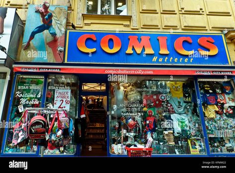 Download this stock image: Comics store, front door, entrance, shop windows, colorful superhero spiderman sign. Retail toy shop exterior. Vienna, Wien, Austria, Europe EU. - KFMM22 from Alamy's library of millions of high resolution stock photos, illustrations and vectors. Spiderman Sign, Superhero Vbs, Entrance Signage, Shop Exterior, Superhero Spiderman, Small Business Signs, Comic Book Shop, Dc Comics Wallpaper, Shop Doors