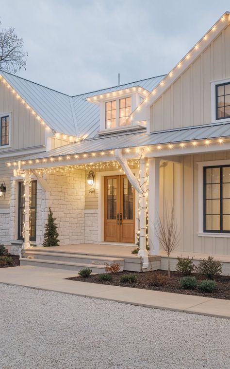 Modern Farmhouse Chimney Exterior, Exterior House Upgrades, Modern Farmhouse Exterior Christmas Decor, Farmhouse Exterior Christmas Lights, White Farmhouse Christmas Decor Exterior, Farmhouse Porch Christmas Lights, White Christmas Lights Outdoor House, Exterior House Christmas Lights, Light Tan House Exterior