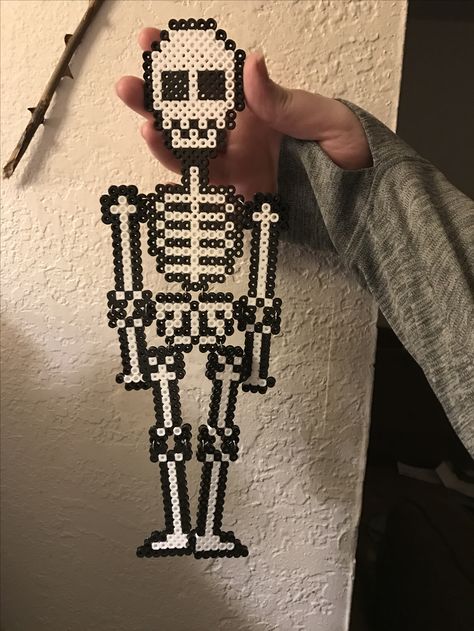 Perler skeleton with a bit of a wiggle Perler Beads Skeleton, Skeleton Perler Beads, Skeleton Pixel Art, Perler Projects, Perler Ideas, Skeleton Head, 3d Skull, Beads Designs, Beads Ideas