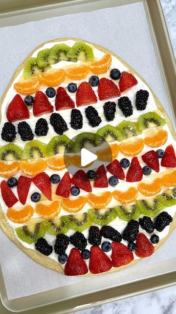 Maegan Brown ~ The BakerMama on Instagram: "GIANT EASTER EGG FRUIT PIZZA 🍊🍓🫐🥝🥚 With a sugar cookie crust, sweet icing and plenty of colorful fresh fruit, it’s so bright and beautiful and oh my gosh, so yummy! 😋

Comment “recipe” and I’ll DM you the link! or tap the link in my bio @thebakermama! 🤗 #TheBakerMama 

https://thebakermama.com/recipes/giant-easter-egg-fruit-pizza/

#easteregg #fruitpizza #easter #springtime #dessertpizza #fruitdessert #easterbrunch #sugarcookie #freshfruit" Fruit Pizza Easy, Egg Fruit Pizza, Sugar Cookie Easter, Easter Egg Fruit Pizza, Spring Dessert Ideas, Homemade Sugar Cookie Dough, Egg Fruit, Fruit Sugar Cookies, Mini Snacks