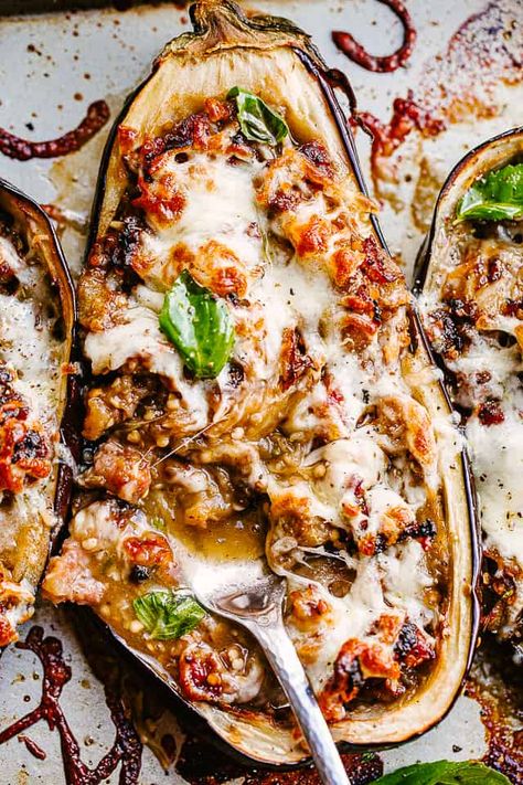 Sausage Stuffed Eggplant – These sausage stuffed eggplant boats are as tasty as they are fun to eat. Stuffed with spicy sausage and topped with cheese, this eggplant recipe is a satisfying, healthy dinner you’ll go back to again and again. Eggplant And Pork Recipes, Sausage Stuffed Eggplant Recipes, Stuffed Eggplant Recipes Healthy, Keto Stuffed Eggplant Recipes, Baked Stuffed Eggplant, Baked Eggplant Recipes, Eggplant Boats, Eggplant Recipes Healthy, Best Eggplant Recipe