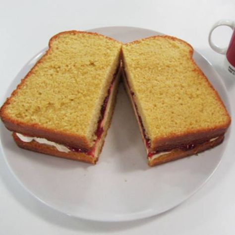 Cake baker:Frances Quinn "I created a Giant Jam Sandwich cake for my friend Hannah's birthday using the simple vanilla sponge recipe. Hannah's favorite cake is normally a Victoria Sponge, so I decided to give the Simple Vanilla Cake a twist by turning it into the shape of a giant sandwich! The sponge itself was still filled with cream and jam and could be enjoyed as either an open or shut cakewich. " Giant Sandwich, Birthday Afternoon Tea, Marmalade Sandwich, Simple Vanilla Cake, Frances Quinn, Jubilee Cake, Sponge Recipe, Jam Sandwich, Healthy Brunch Recipes