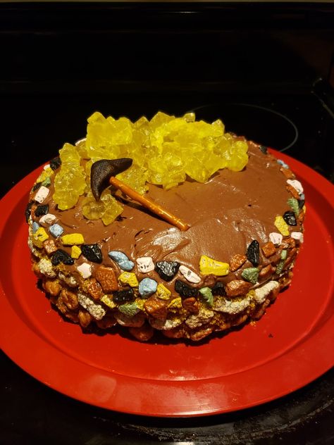 For the gold mining site cake I layered different types of "rock looking" candies on the outside, yellow rock candy on top for gold nuggets, and a pickax from almond paste, food coloring, and a pretzel stick. Gold Mining Birthday Party, Mining Birthday Party, Rock Cake, Pretzel Sticks, Almond Paste, Gold Mining, Rock Candy, Gold Birthday, Gluten Free Desserts