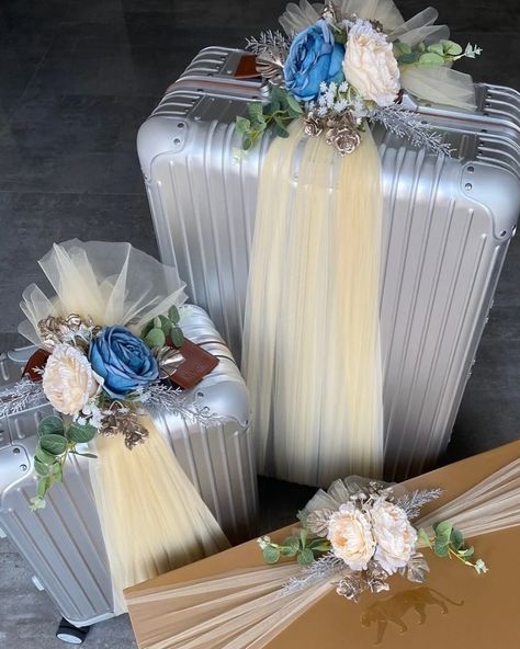 Elevating elegance with trousseau packing on silver luggage and the iconic Sabyasachi outfit box. Adorned with blue and cream floral detailing, each piece is a blend of tradition and sophistication. Make your special moments unforgettable with Humsa’s bespoke touches. #HumsaDecor #TrousseauPacking #LuxuryLuggage #FloralElegance #CelebrateInStyle Silver Luggage, Trousseau Packing, Luxury Luggage, Special Moments, Bespoke, Make Your, Make It Yourself, In This Moment, Cream