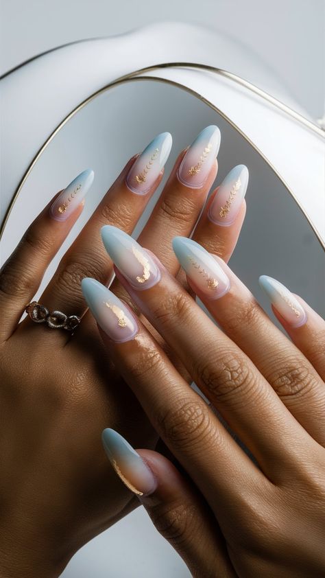 Elevate your nail art game with these stunning baby blue ombre nails, beautifully enhanced with glamorous golden elements! The soft gradient transitions from a tranquil blue to a delicate hue, while shimmering gold details add a touch of luxury and elegance. Perfect for special occasions or a night out, this manicure balances playful sophistication with a hint of shine. Style it with chic outfits and statement jewelry for an unforgettable look! ✨💙 #OmbreNails #GoldAccents #NailInspo Light Blue Gold Nails, Baby Blue Ombre Nails, Blue Gold Nails, Light Blue Nail, Light Blue Nail Designs, Blue Ombre Nails, Soft Gradient, Light Blue Nails, Tranquil Blue