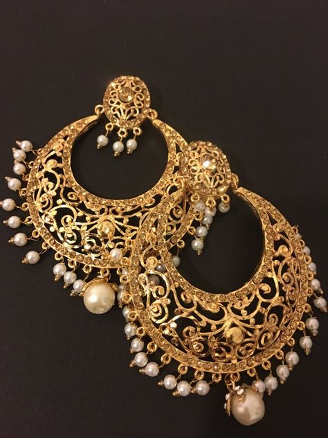 beautiful big size handcrafted gold plated Hyderabadi chandbali earrings. The earrings are embellished with stones and pearls to finish the look. Hyderabadi Jewellery, Handmade Necklace Designs, Hyderabadi Jewelry, Sabyasachi Jewellery, Gold Earrings Models, Bridal Jewellery Design, Indian Jewellery Design Earrings, Bridal Gold Jewellery Designs, Jewelry Design Earrings