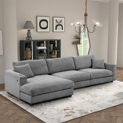 The extra-wide seat and chaise lounge provide luxurious and comfortable seating options, enhanced by convenient features like cup holders and USB charging ports. The thick corduroy fabric adds to the overall comfort and elegance of the sofa, making it a perfect choice for any living space. Body Fabric: Gray Corduroy | Gray Sectional - HongJunFurniture Modern Oversized L-Shaped Corduroy Sectional Sofa w / USB Port & Cup Holder Corduroy | Wayfair Modern Sectional Sofa, Pit Couch, Couches Living Room Comfy, Comfy Sectional, Grey Couch Living Room, Grey Sectional, Living Room Sectional, Couches Living Room, Decor Home Living Room