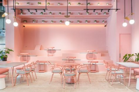 Seeking an inclusive café experience for a venue in Indonesia, AlvinT Studio makes a colourful interlude to step outside the box. Pink Restaurant, Korean Cafe, Pink Cafe, Decoration Restaurant, Coffee Shops Interior, Ottoman Coffee, Retro Interior, Coffee Shop Design, Tables And Chairs