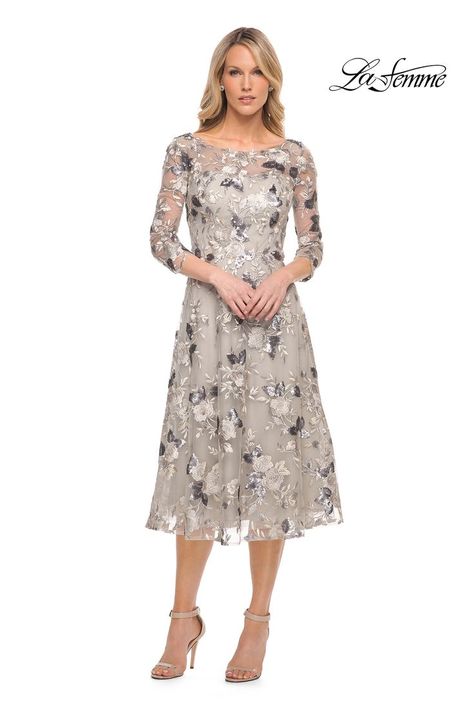 Silver tea length mother of the bride dress with three-quarter sleeves and illusion neckline. Features lace with sequin embellishment. #motherofthebride #motherofthegroom #motherofthebridedress #motherofthegroomdress #weddingattire #weddings #occasionwear #dresses #mumofthebride Bride Gown, Bride Outfits, Wedding Traditions, Groom Dresses, Bateau Neck, Illusion Neckline, Tea Length Dresses, Bateau Neckline, Cocktail Dress Lace