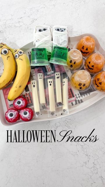 Kristen Racanati on Instagram: "It doesn’t get easier than this! Unless you use @instacart to grab all the essentials. Grocery list below of everything you need. 🎃 https://instacart.oloiyb.net/oqBErY    SAVE this post for your October festivities ✨   What you’ll need: • string cheese • lime Jell-o • mandarin oranges fruit cups • juice boxes  • bananas • babybel cheese - craft eyes - napkins - black sharpie marker  . . . #supersimple #halloweenfood #halloweenfoodideas #halloweensnacks #halloweenkids #halloweenkidsparty #schoolparty #halloweenparty #kidshalloweenparty #halloweenideas #funwithfood #foodfun #halloweenlife #spookyseason #spooky #spookyvibes #boo #pumpkin #fallyall" Halloween Apple Juice Boxes, Halloween String Cheese Ideas, Mummy Juice Boxes, Halloween Juice Box Ideas, Essentials Grocery List, Halloween Juice Boxes, Halloween Juice Box, Oranges Fruit, Halloween Juice