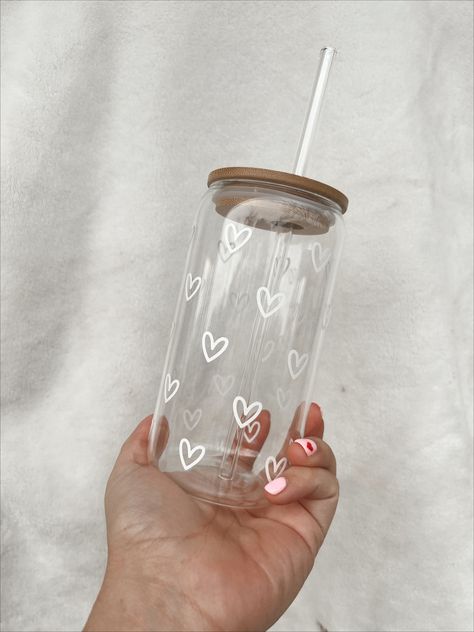 hearts on hearts 🤍 -all items are made to order  -turnaround time is 5-7 days  -cups are NOT microwave or dishwasher safe!  -gently scrub design  -do NOT submerge  All cups are 16 oz glasses with a bamboo lid + glass straw!  *designs are made with permanent vinyl*  follow along on instagram @justbubbalie 🤍 Glass Tumbler Aesthetic, Glass Cup With Bamboo Lid Designs, Vinyl On Cups, Vinyl Cup Ideas, Glass Cups With Vinyl, Cute Glass Cups, Glass Tumbler Design, Heart Cup, Girly Christmas Gifts