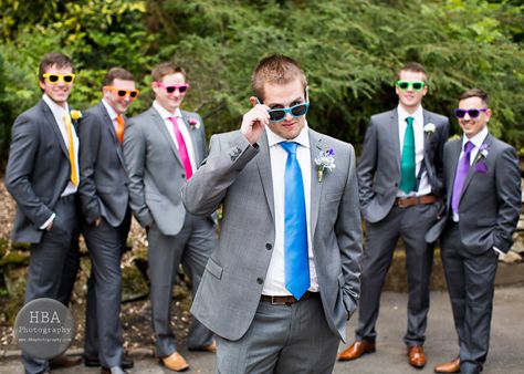 rainbow groomsmen (: coloured ties and sunglasses. Nice, I wont be doing the sunglass thing lol Rainbow Wedding Groomsmen, Rainbow Groomsmen, Colorful Groomsmen, Wedding Suits Men Grey, Groomsmen Ideas, Groomsmen Tuxedos, Grooms Men, Grey Suit Wedding, Groom Photoshoot