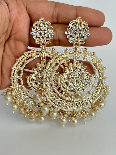 Gold Bollywood Stone Kundan Earrings Indian long Earrings/pearl Earring/Pakistani Earrings/Statement Earrings/Long chandelier/bridal earrings Length 3.5 inches Width 2.5 inches Arrives in a gift box Color, shades, and texture displayed may slightly vary from the actual product due to digital image limitations. We request that you to consider these minor variations. Please expect the possibility of some slight imperfections when buying handmade jewelry. If you have any questions, please contact u Multani Earrings, Chaandbali Kundan, Punjabi Jewellery, Pakistani Earrings, Stained Glass Earrings, Yumna Zaidi, Promise Jewelry, Bridal Earring, Indian Accessories