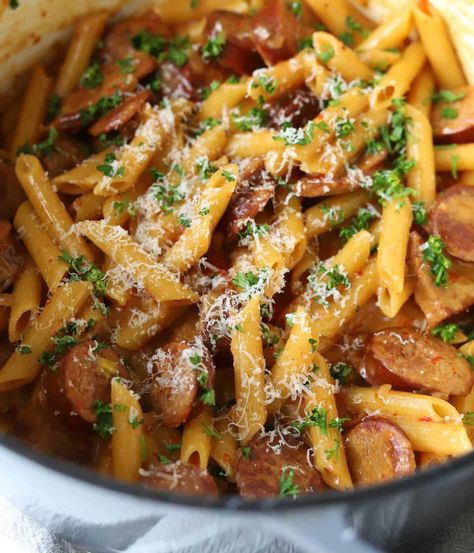 This Kielbasa Pasta is a Cheesy One Pot meal that is ready in just 30 minutes for the best weeknight dinner. It's filled with flavor from the smoky sausage and roasted red peppers to the creamy pasta! Kielbasa And Pasta Recipes, Kielbasa Pasta Recipes, Kilbasa Sausage Recipes, Gouda Recipe, Sausage And Peppers Pasta, Kielbasa Pasta, Sausage Recipes For Dinner, Smoked Sausage Recipes, Sausage Dinner