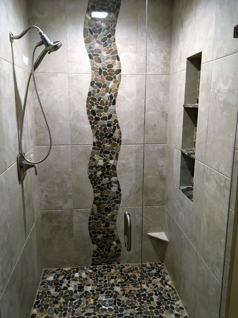 River rock shower wall design Shower Rock Wall, Stone Showers Walk In, Rock Shower Wall, Waterfall Tile Shower Design Accent Wall, River Rock Shower Ideas, Waterfall Tile Shower Design, Shower River Rock Floor, Shower With Pebble Floor River Rocks, Rock Shower Ideas