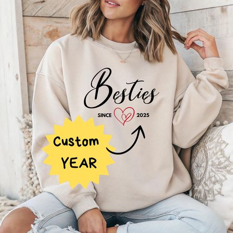 Besties Since [Year] - Custom Sweatshirt & T-Shirt ️❤️ Celebrate your friendship with this cozy and stylish "Besties Since [Year]" sweatshirt or t-shirt! ✨ Personalize it with the year you met your best friend and create a unique keepsake that symbolizes your unbreakable bond. The elegant script and cute heart design make this the perfect gift for your BFF. Whether for birthdays, Galentine's Day, or just because - this piece will remind you both of your special connection. How to Personalize Your Order 🖊️ 1.Select the type ans size - Choose between a T-shirt or Sweatshirt 👕👚 2.Choose your color - Find the perfect shade for you 🎨 3.Enter your year - Add the special year (e.g., "2015") in the personalization box ✨ 4.Place your order - Double-check the details and complete your purchase ? Year Sweatshirt, Bff Shirts, Long Distance Friendship, Eco Friendly Design, Soul Sisters, Best Friend Birthday, Cute Heart, Custom Sweatshirts, Girls Party