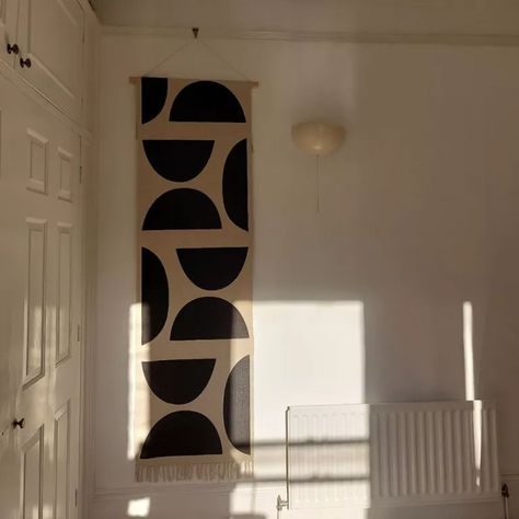 Hanging rug on wall