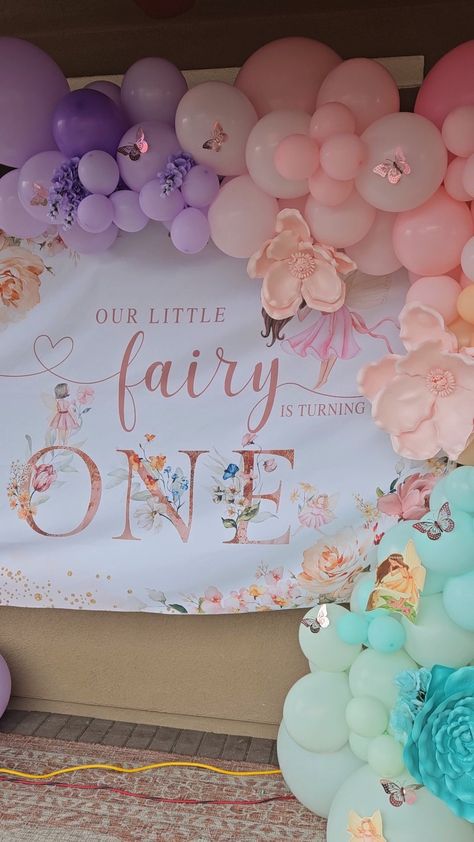 Fairy theme backdrop, balloon garland Fairy First Balloon Garland, Fairy 1st Birthday Backdrop, Fairy Birthday Backdrop Ideas, Fairy Birthday Balloon Arch, Fairy Onederland Party, My Fairy First Birthday Centerpieces, No Balloon Backdrop, Fairy First Birthday Balloon Garland, Fairy Theme Backdrop