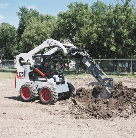 Bobcat's S175 skid steer digs in with the backhoe attachment. The S175 marks the beginning of Bobcat's vertical lift lineup.    Full specs:  http://www.specguideonline.com/product/bobcat-s175    #construction #equipment #skidsteers Bobcat Equipment, Mighty Machines, Equipment Operator, Skid Steer Attachments, Bobcat Skid Steer, Construction Vehicle, Gear Pump, Skid Steer, Heavy Machinery