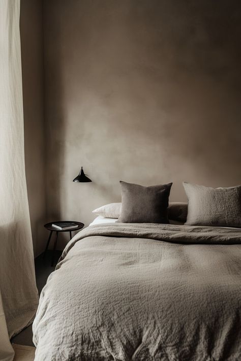 Embrace the serene beauty of minimalism with this stunning bedroom featuring lime washed walls. The soft, natural texture adds depth and warmth, creating a tranquil retreat that's as stylish as it is calming. #MinimalistDesign #LimeWashedWalls #SereneSpaces #BedroomInspiration Limewash Bedroom Accent Wall, Venetian Plaster Walls Bedroom, Grey Limewash, Lime Plaster Bedroom, Limewash Guest Bedroom, Neutral Limewash Walls, Lime Washed Walls, Taupe Lime Wash, Beige Limewash Bedroom