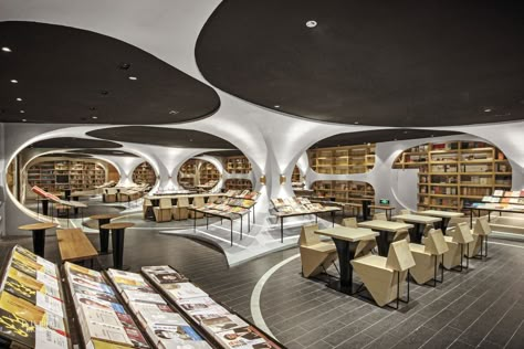 This bookstore is an architectural adventure for all ages. Zhongshuge Bookstore, Yangzhou China, Museum Interior, Retro Future, Library Architecture, Yangzhou, Futuristic Interior, Architecture Concept Drawings, Showroom Design