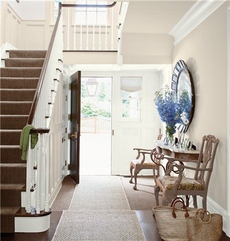 Look at the paint color combination I created with Benjamin Moore. Via @benjamin_moore. Walls: Cedar Key 982; Trim: White Dove OC-17; Stair Wainscot: First Crush CSP-310; Chairs: Rockies Brown 2107-30. Entryway Color Ideas, October Mist, Entryway Colors, Pastel Paint Colors, Faux Wainscoting, Wainscoting Styles, Color Combinations Paint, New Paint Colors, Trending Paint Colors