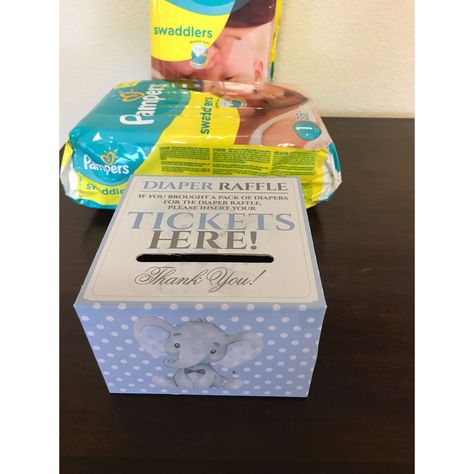 Baby Boy Elephant Theme Shower 🐘💙 Diaper Raffle Box Diaper Raffle Box Ideas, Diaper Raffle Table Set Up, Boy Moreno, Baby Shower Tissue Box Game, Elephant Theme Gender Reveal Centerpieces, Free Printable Diaper Raffle Tickets, Elephant Babyshower, Raffle Box, Elephant Baby Shower Theme Body Wash