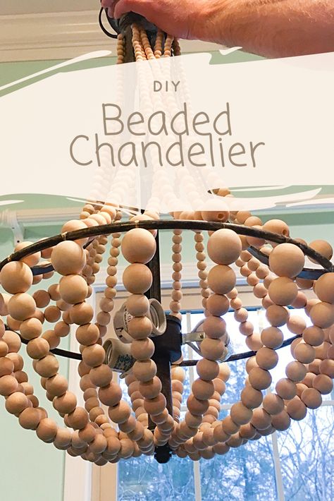 DIY Wooden Beaded Chandelier – Raising These Kentucky Seeds Wooden Bead Chandelier Diy, Wooden Beaded Chandelier, Building A New House, Wooden Bead Chandelier, Chandelier Diy, Bead Chandelier, Sphere Light, Wagon Wheel Chandelier, Diy Chandelier