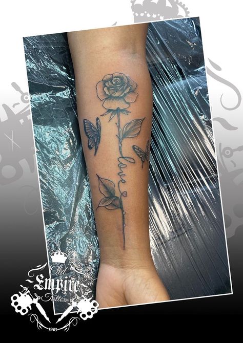 Beautiful Rose stem script butterfly design for our clients arm 🖤🥀 #rosetattoo #scripttattoo #butterflytattoo #oldempiretattoostudio #salfordoriginal #LittleHulton #manchester #blackandgreyrealism #blackandgreyink #inkideas #tattooartist #tattoodesign #girlswithink #weloveink Rose With Stem, Empire Tattoo, Script Tattoo, Tattoo Script, Rose Stem, Rose Tattoo, Beautiful Rose, Butterfly Design, Butterfly Tattoo