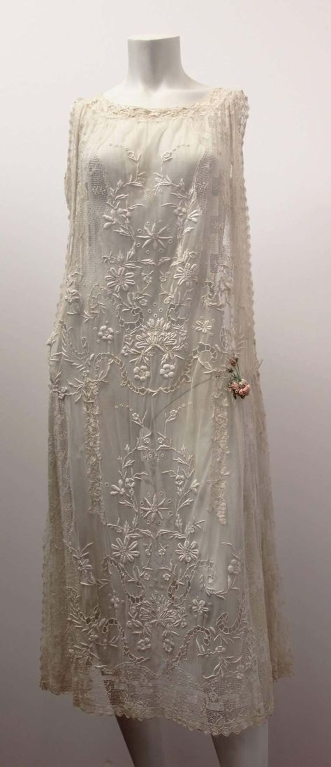 For Sale on 1stDibs - 1920's floral lace wedding dress. Mesh side panels. Satin drop-waisted sash*. Pink satin ribbon rose detail on side. *not shown in photo silver-toned rhinestone Edwardian Beauty, Embroidered Lace Wedding Dress, Vintage Weddingdress, Dramatic Romantic, 1920s Wedding Dress, Floral Lace Wedding Dress, Period Clothing, Ribbon Rose, Chiffon Collection